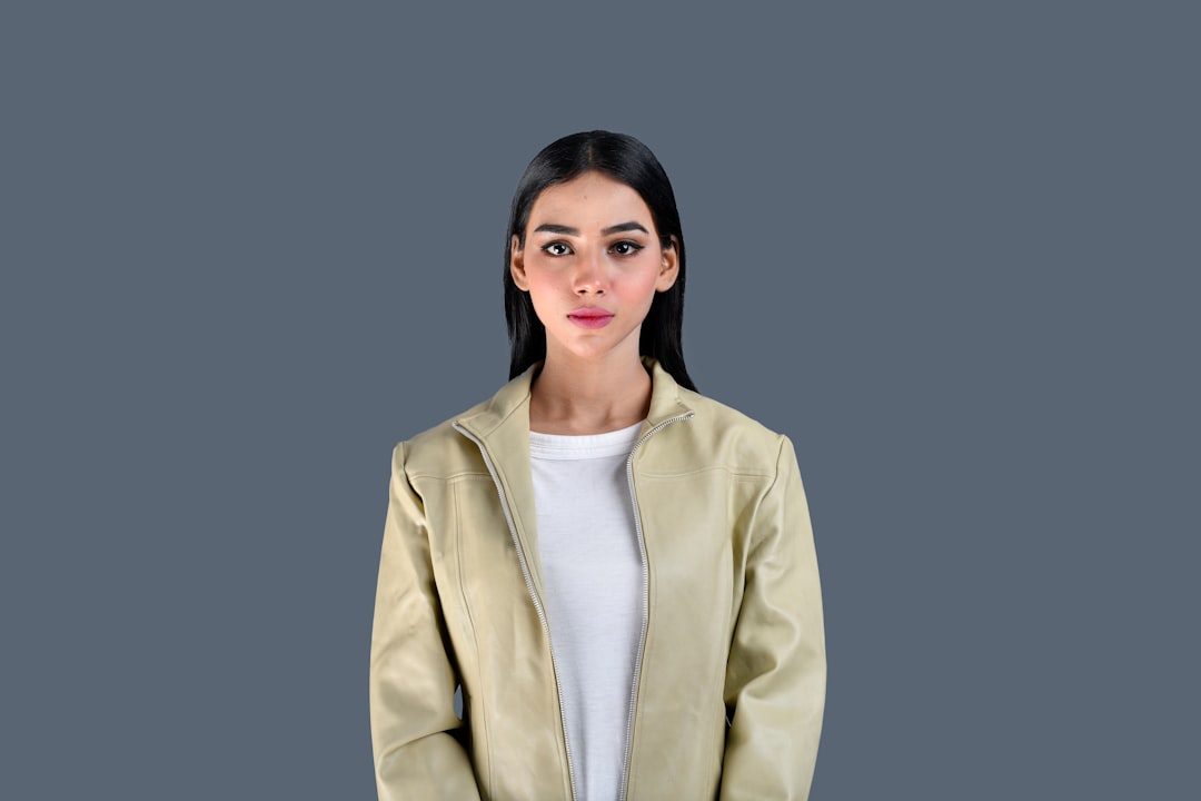 a person in a yellow jacket ai editing workspace background remover product portrait design tools