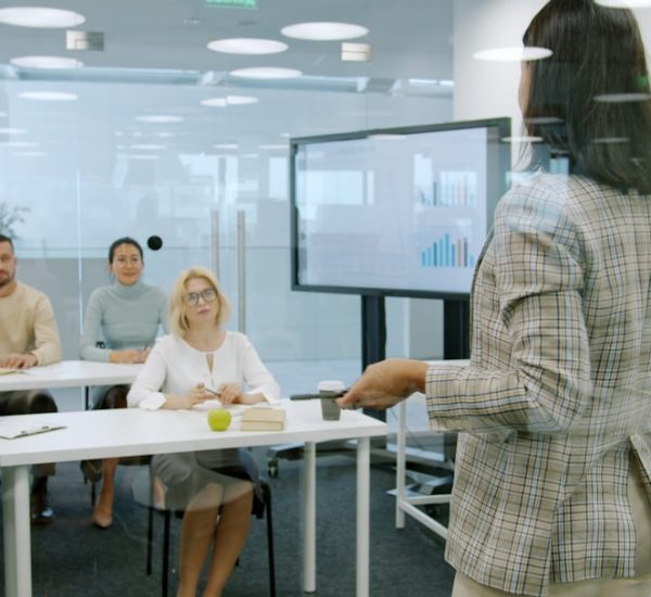 SafeShare Alternative: The Best SafeShare Alternatives for Sharing, Embedding, Managing, and Viewing Online Video Content 2 woman presenting to an attentive audience in a modern office online video training business presentation team learning