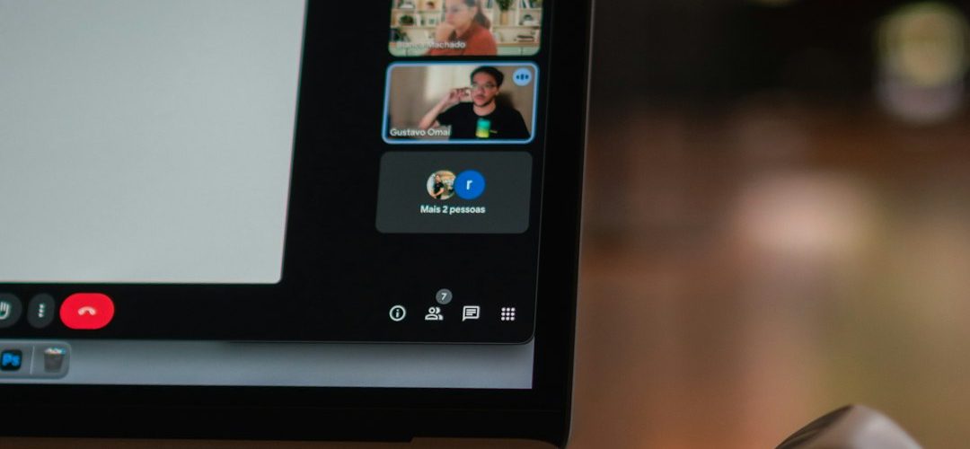 laptop screen showing a video conference with multiple participants remote team video meeting collaboration tools