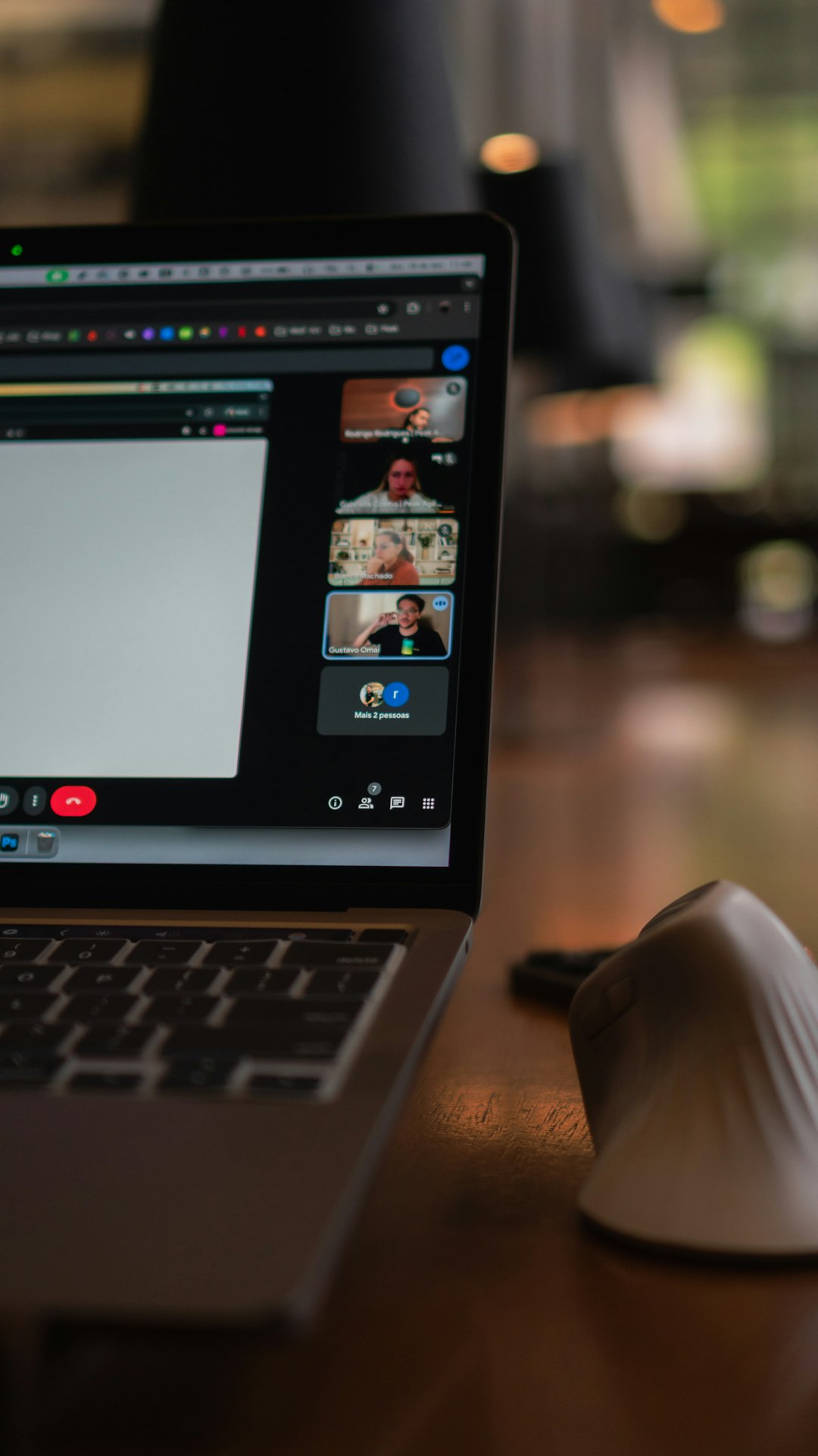 laptop screen showing a video conference with multiple participants remote team video meeting collaboration tools