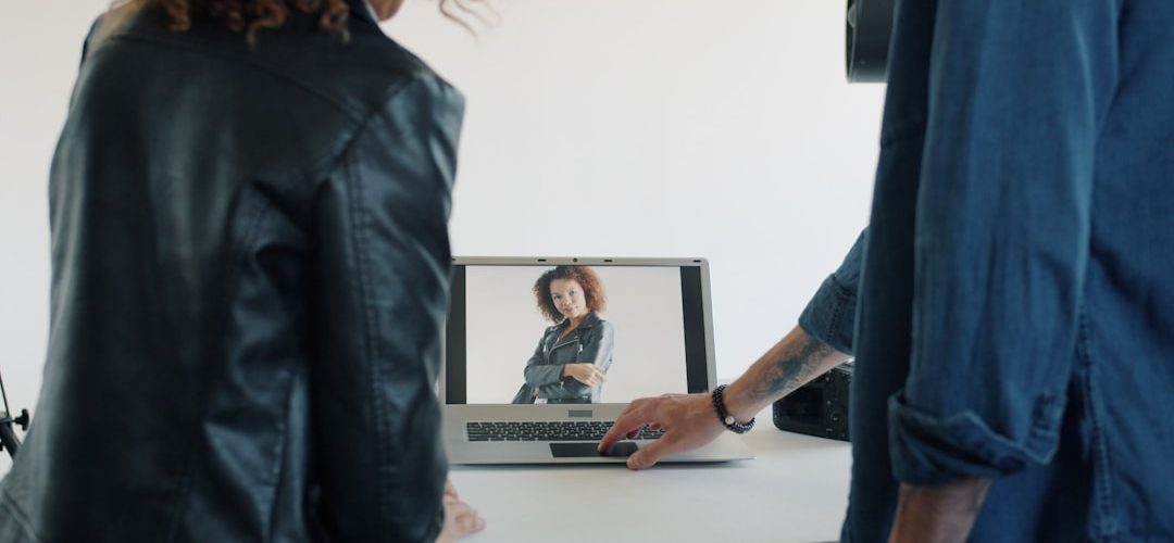 two people looking at a laptop screen asynchronous communication screen recording remote training