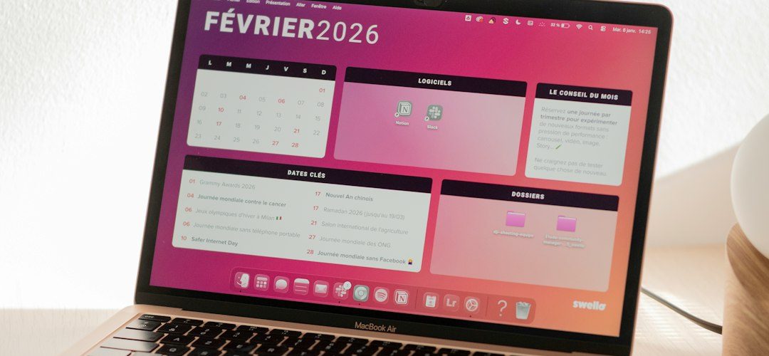 laptop displaying a colorful february 2026 calendar wordpress calendar booking dashboard
