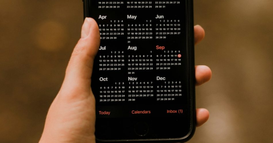person holding black android smartphone business event calendar mobile