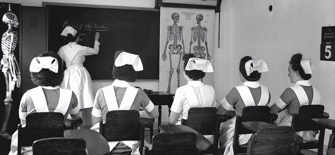 a black and white photo of a classroom virtual classroom 3d anatomy model students wearing vr headsets 2