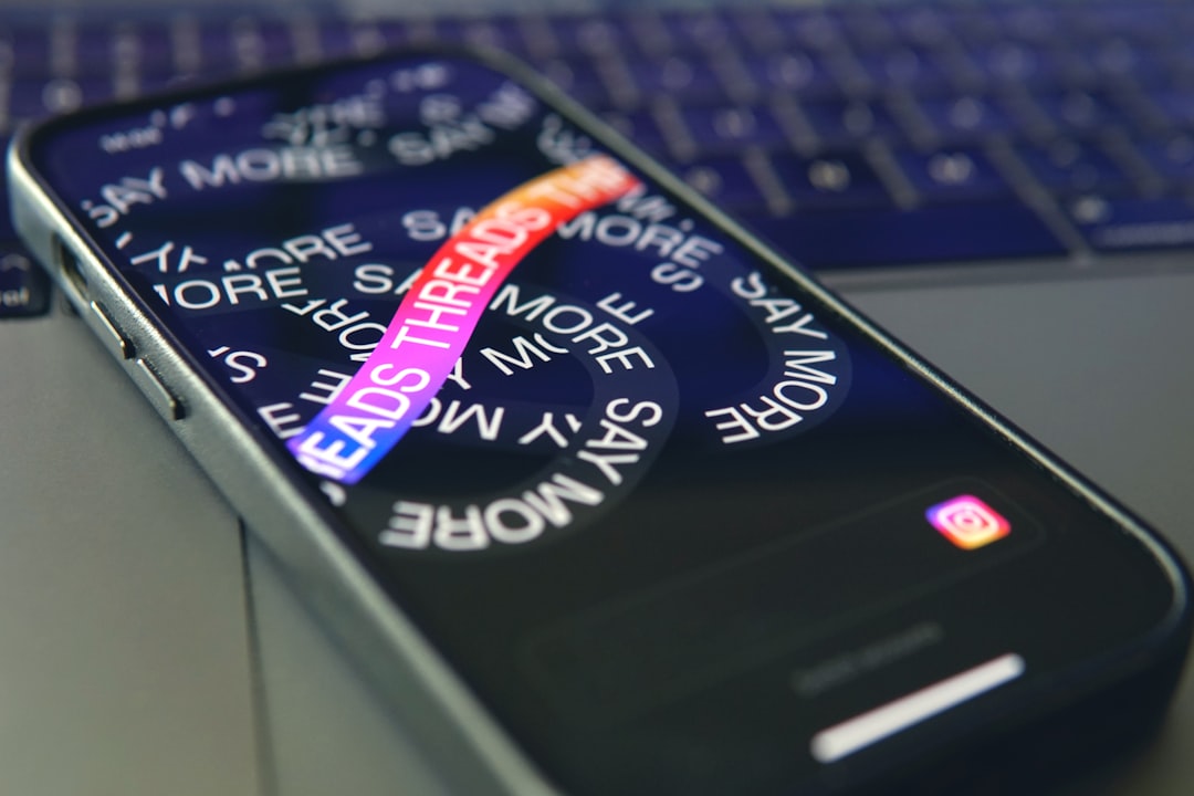 a cell phone sitting on top of a laptop computer language codes smartphone screen translation app