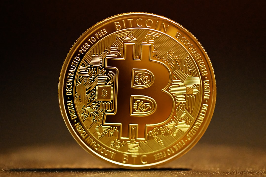 a golden bitcoin sitting on top of a table bitcoin stocks tax documents financial planning