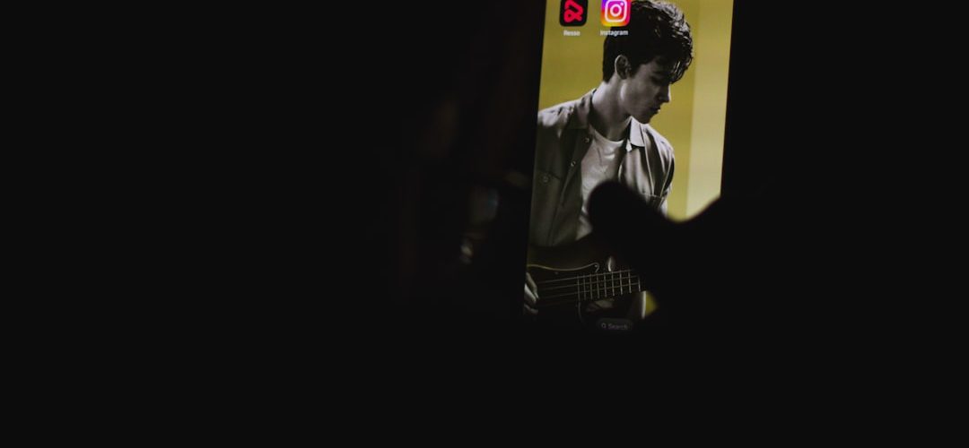 a man playing a guitar in the dark mobile creator face swap reels editing smartphone video