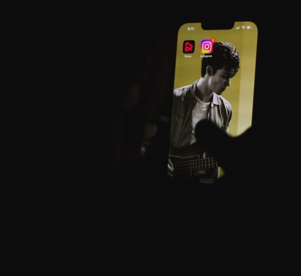 a man playing a guitar in the dark mobile creator face swap reels editing smartphone video