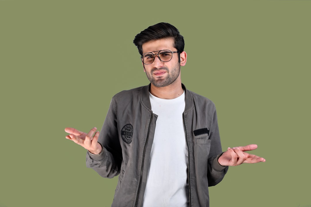 a man wearing glasses confused person floating numbers online slang