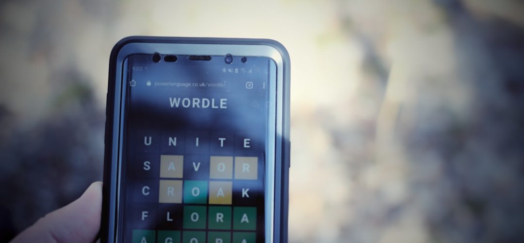 a person holding a cell phone language codes smartphone screen translation app