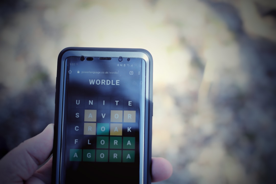 a person holding a cell phone language codes smartphone screen translation app