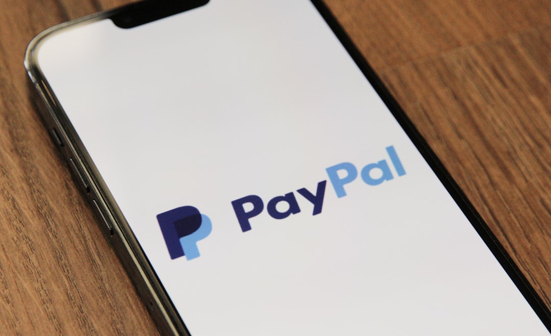 a phone with a pay pay logo on it mobile payment cash balance account closure