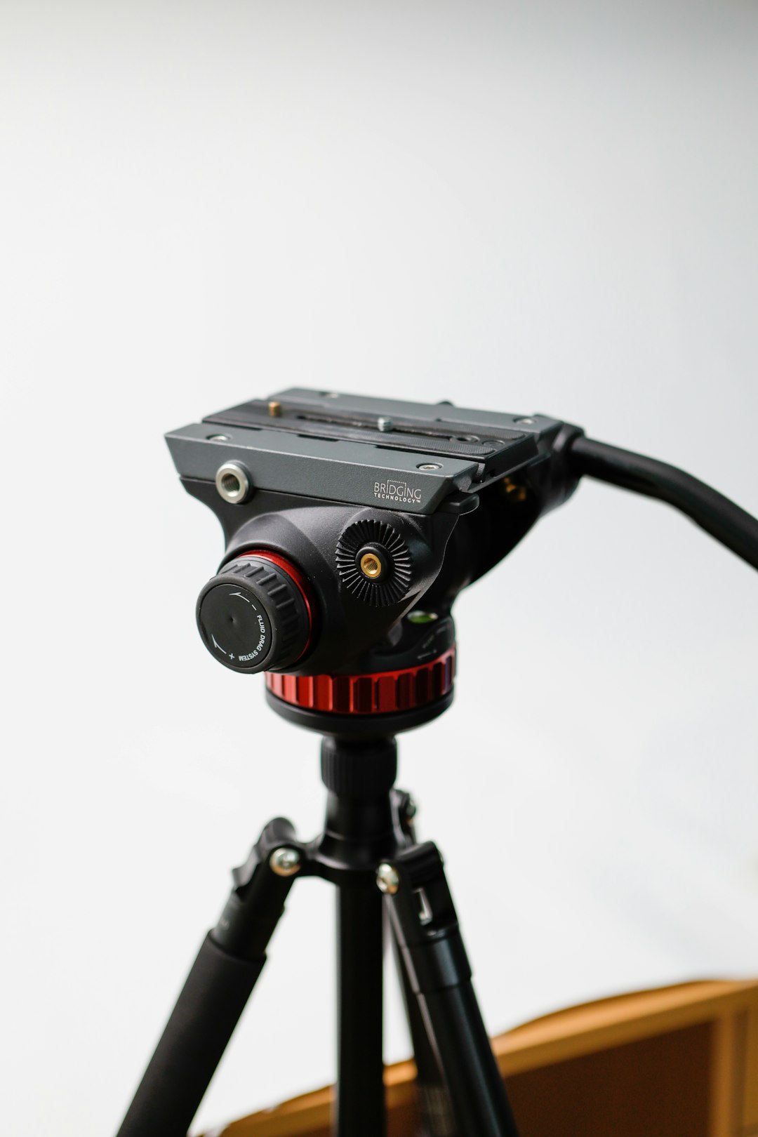a tripod with a camera attached to it tripod camera microphone video gear desk setup