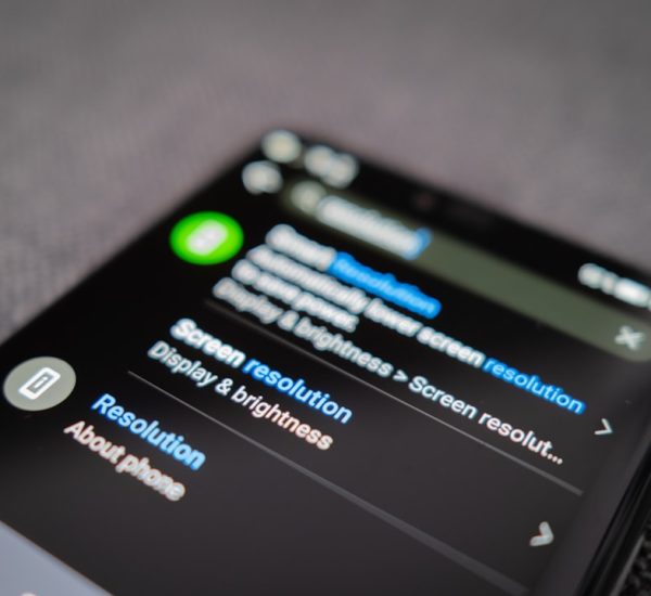 black android smartphone on gray textile android phone battery warning shutdown screen