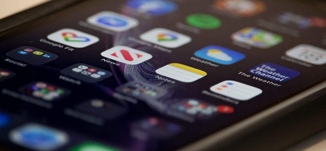 black ipad on white table phone screen app icons prevention tips