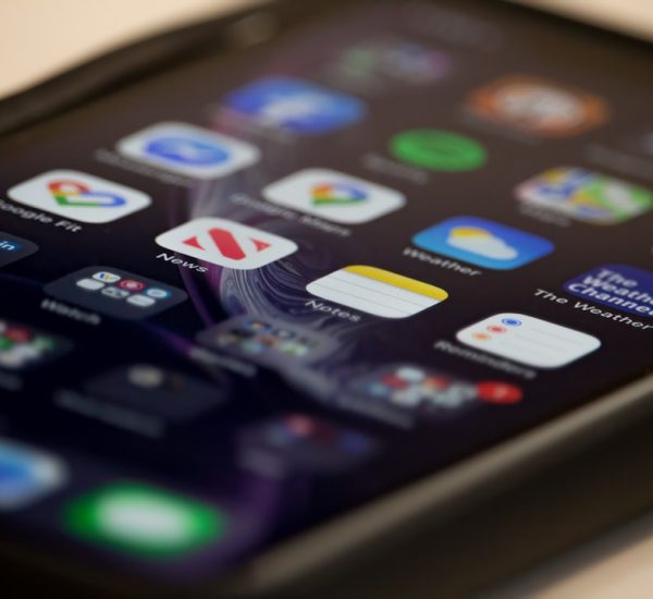 black ipad on white table phone screen app icons prevention tips
