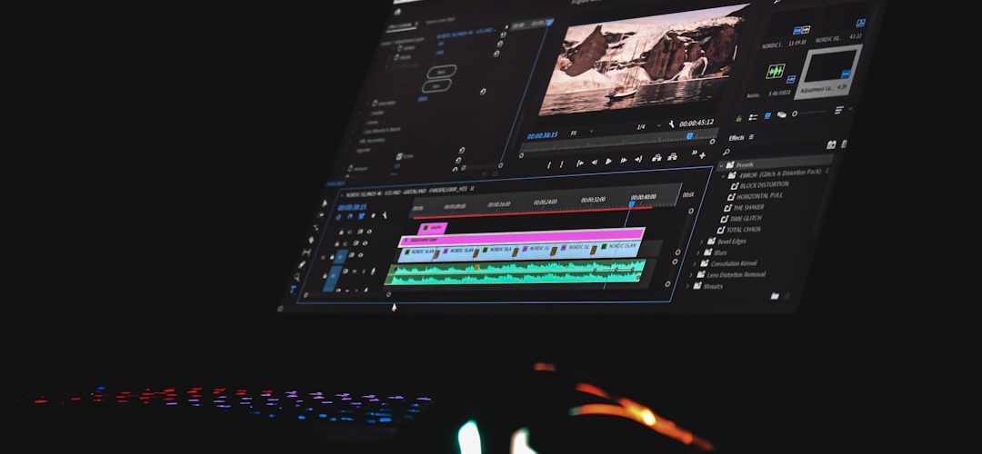 black laptop computer turned on displaying music player cloud video editor team collaboration online timeline