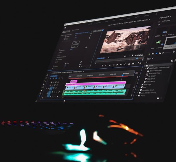 black laptop computer turned on displaying music player cloud video editor team collaboration online timeline
