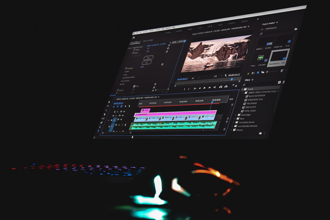 black laptop computer turned on displaying music player cloud video editor team collaboration online timeline