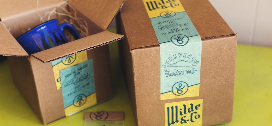 brown cardboard boxes on yellow table barcode printer product packages colorful labels
