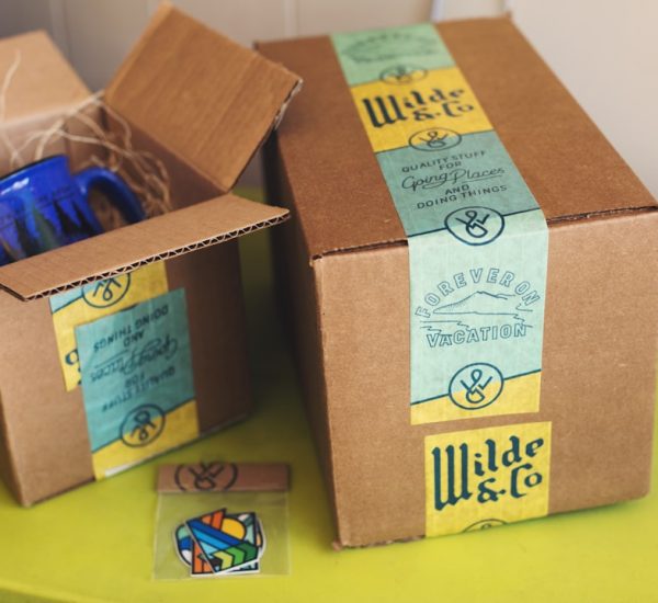 brown cardboard boxes on yellow table barcode printer product packages colorful labels