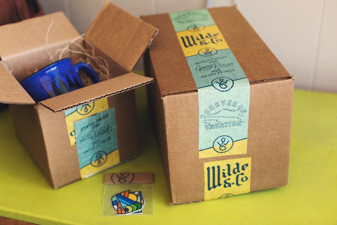 brown cardboard boxes on yellow table barcode printer product packages colorful labels