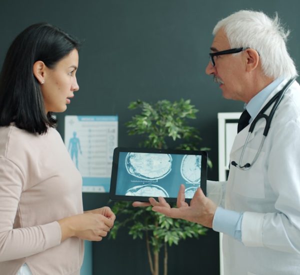 Top HIPAA-Compliant Language Translation Platforms for Patient Communication 8 doctor shows patient medical scan on tablet doctor interpreter tablet patient communication hospital