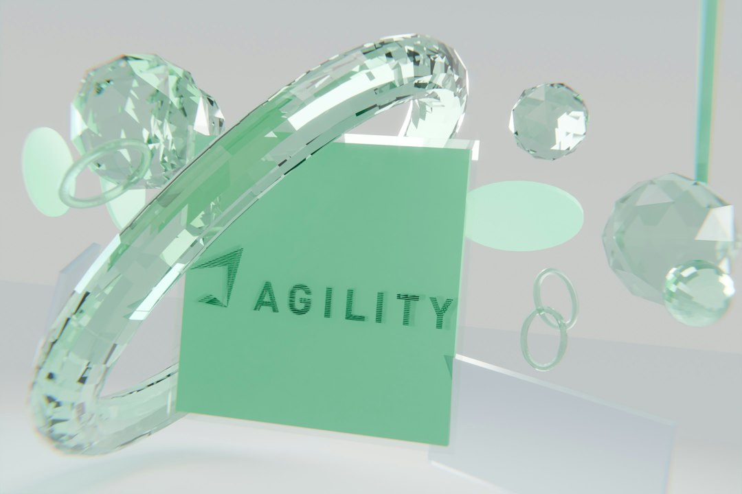 green agility logo surrounded by clear glass geometric shapes software outsourcing client delivery quality assurance