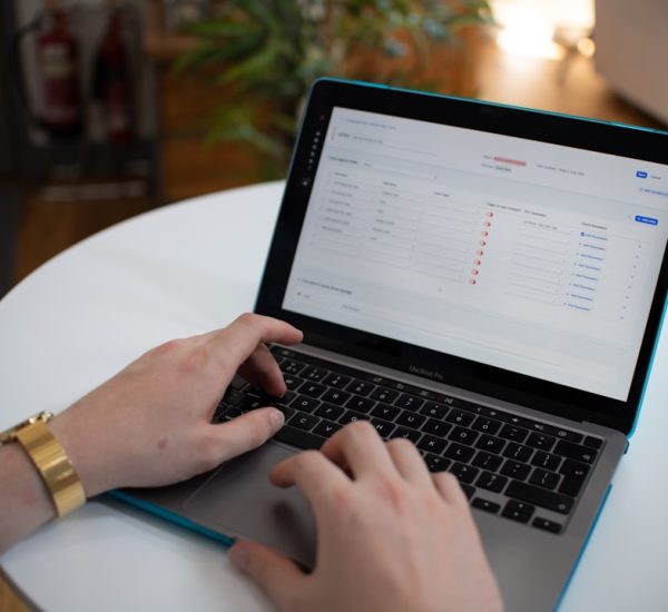 Surface Book 2 In the Box: What Comes With Your Purchase? 8 hands typing on a laptop with a spreadsheet on screen workflow automation business systems ai dashboard 3