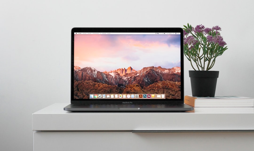 macbook on top white table mac system settings screen sound settings menu macbook display