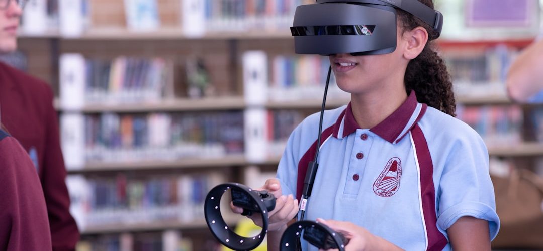 man in white and red polo shirt wearing black headphones virtual classroom 3d anatomy model students wearing vr headsets