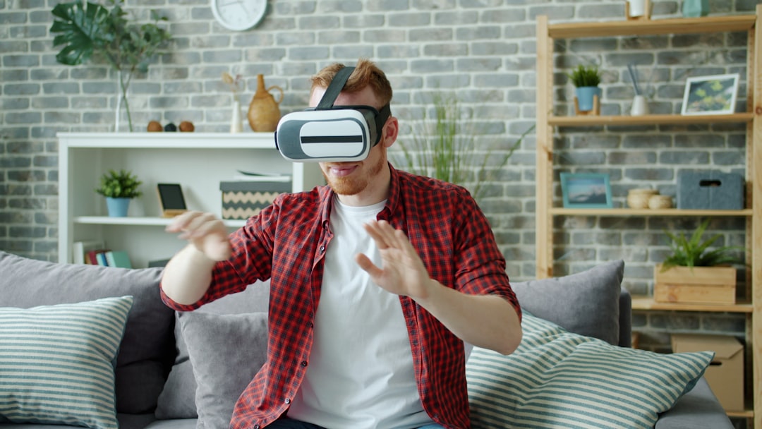 man wearing virtual reality headset playing game at home virtual reality headset user immersive digital environment 3d avatar interaction