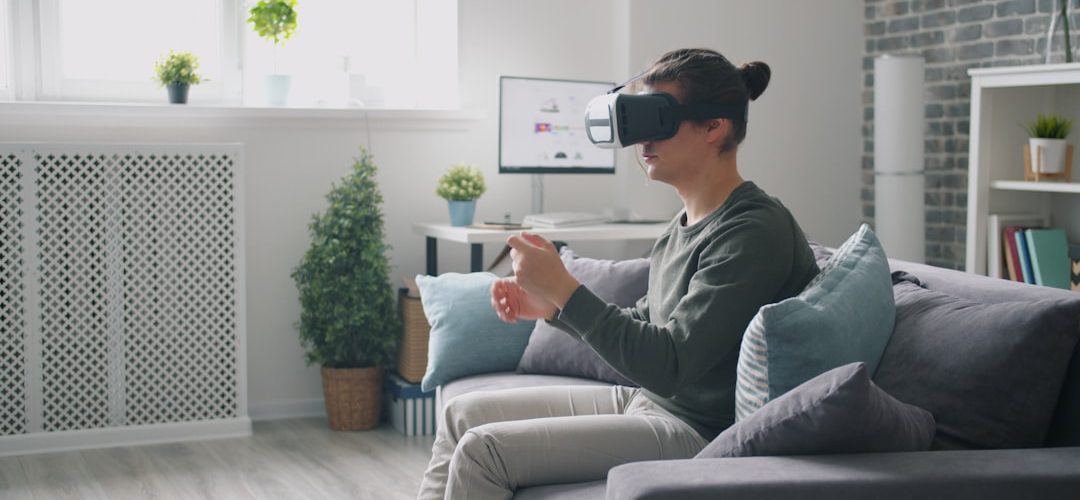 man wearing vr headset playing video game on couch virtual reality headset user immersive digital environment 3d avatar interaction