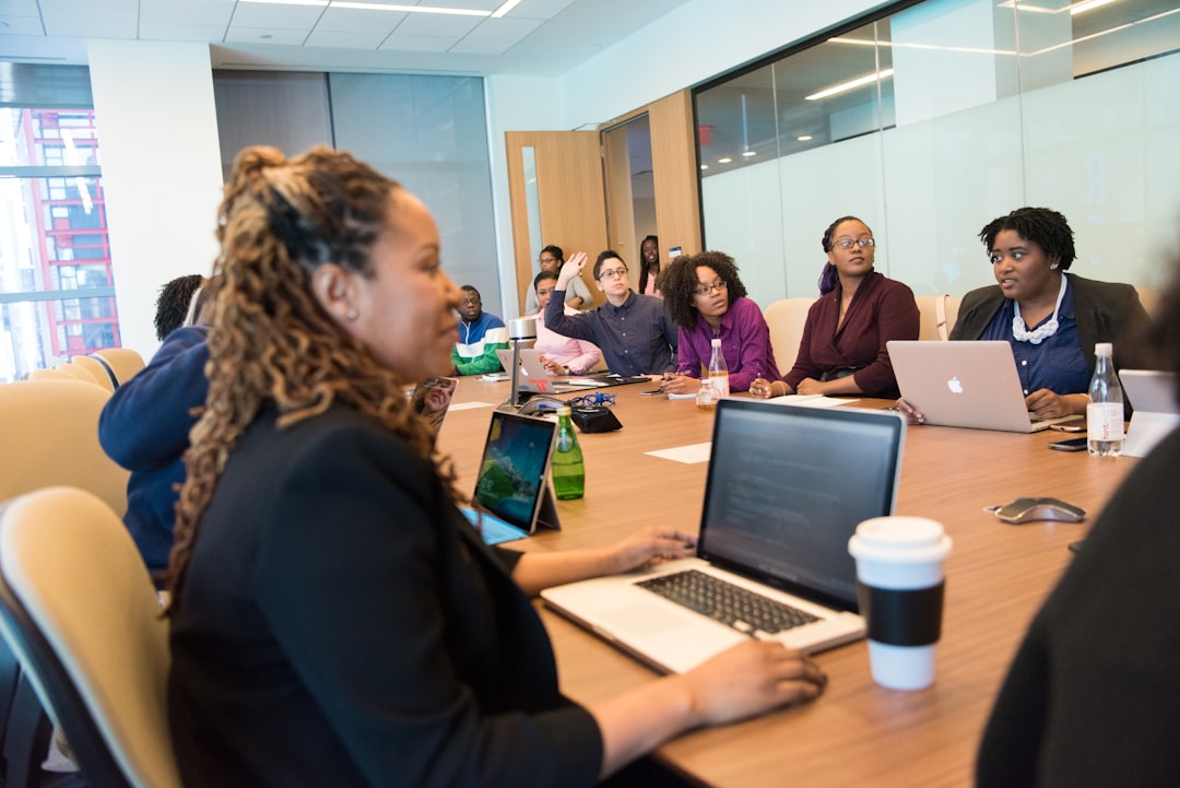 peope sitting around table learning governance human review risk management enterprise technology