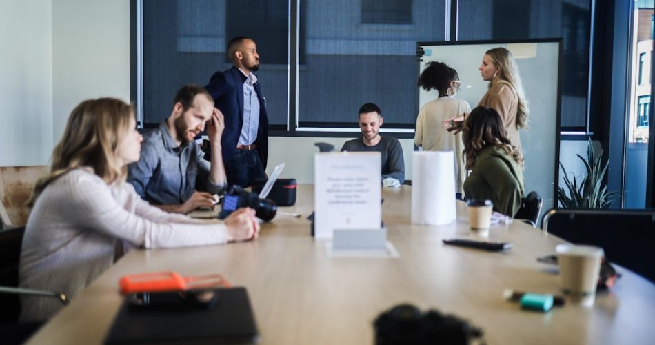people sitting at the table business transformation cloud technology team collaboration