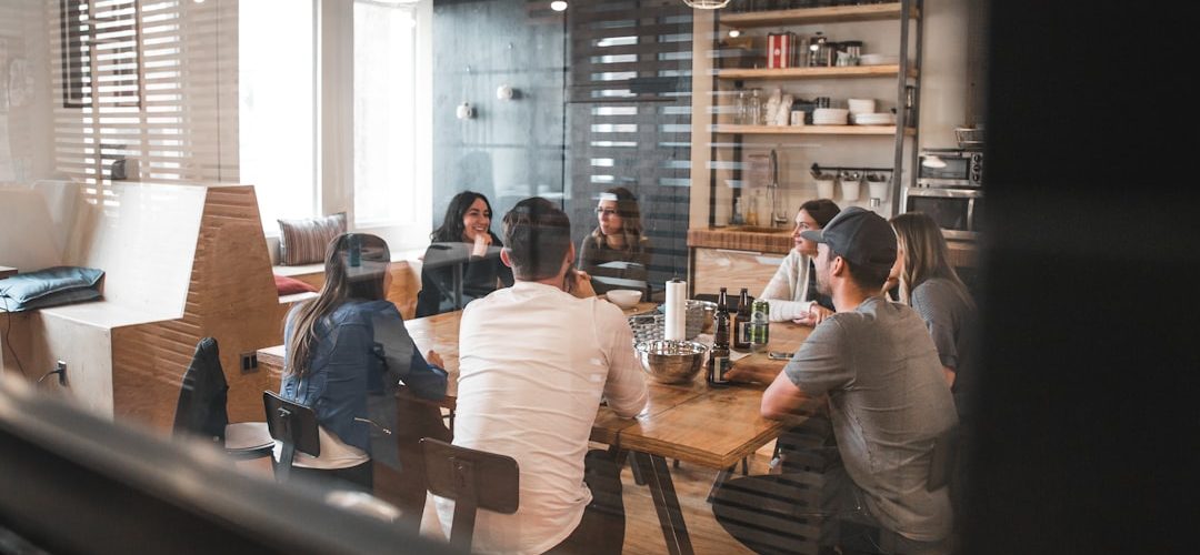 people sitting on chair office team retention strategy marketing meeting