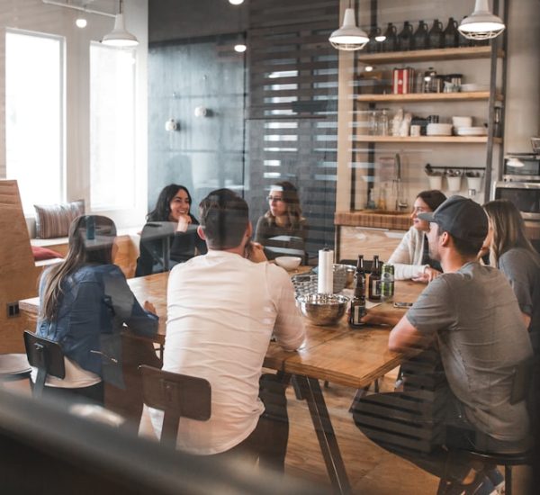 people sitting on chair office team retention strategy marketing meeting