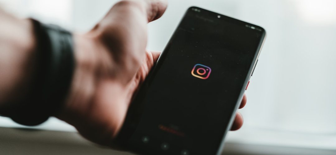 person holding black android smartphone instagram stories mobile screen social media viewer