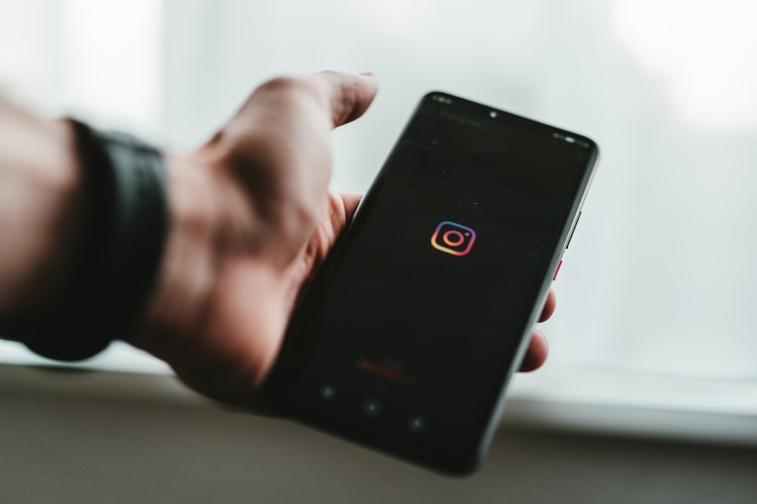 person holding black android smartphone instagram stories mobile screen social media viewer