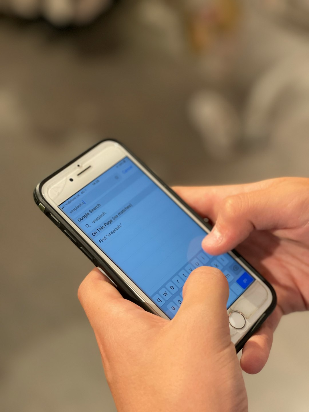 person holding silver iphone 6 texting slang phone chat confused person