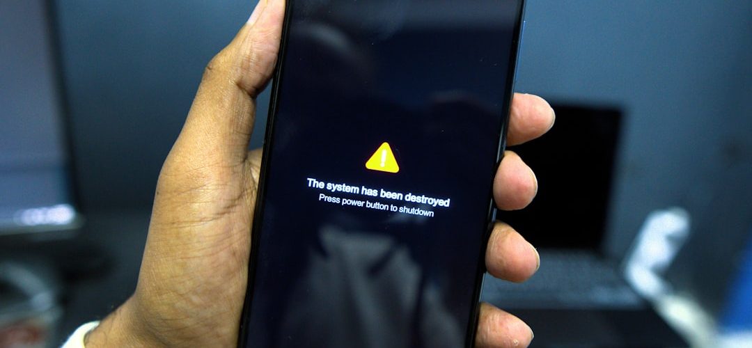phone shows a system failure warning message android phone battery warning shutdown screen