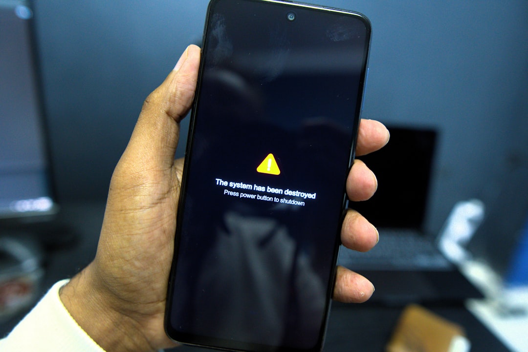 phone shows a system failure warning message android phone battery warning shutdown screen