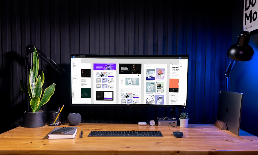 silver imac on brown wooden table social media planning content calendar creative workspace