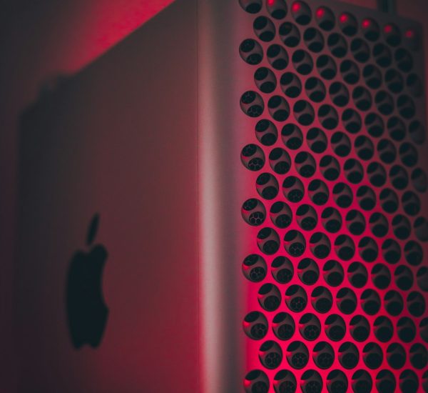 silver ipad on red textile apple silicon chip close up mac motherboard processor detail