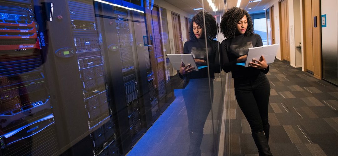 woman in black top using surface laptop business transformation cloud technology team collaboration