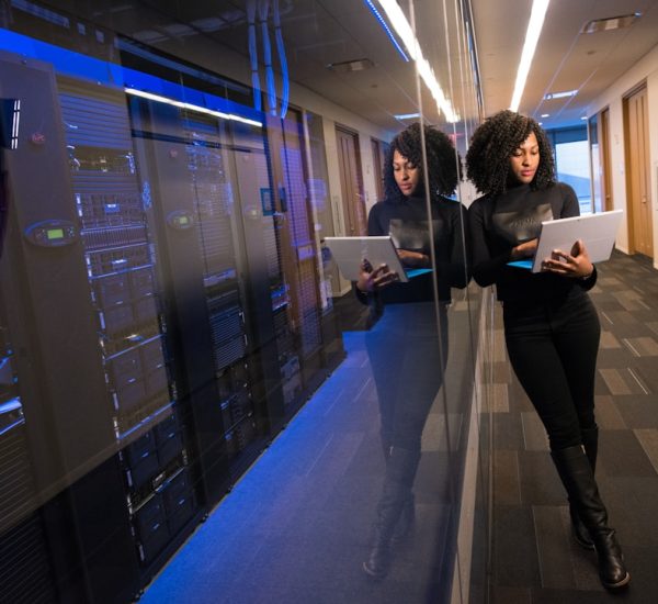 Top Mobile App Design Agencies Specializing in Enterprise Applications 9 woman in black top using surface laptop business transformation cloud technology team collaboration