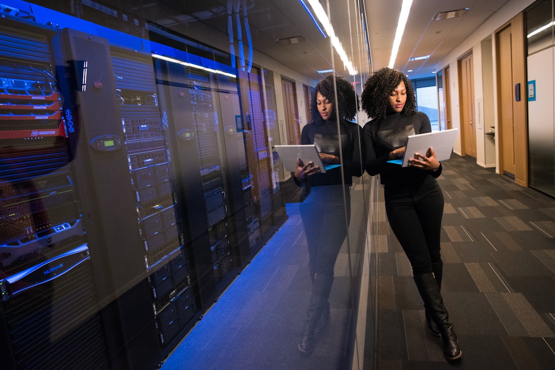 woman in black top using surface laptop business transformation cloud technology team collaboration