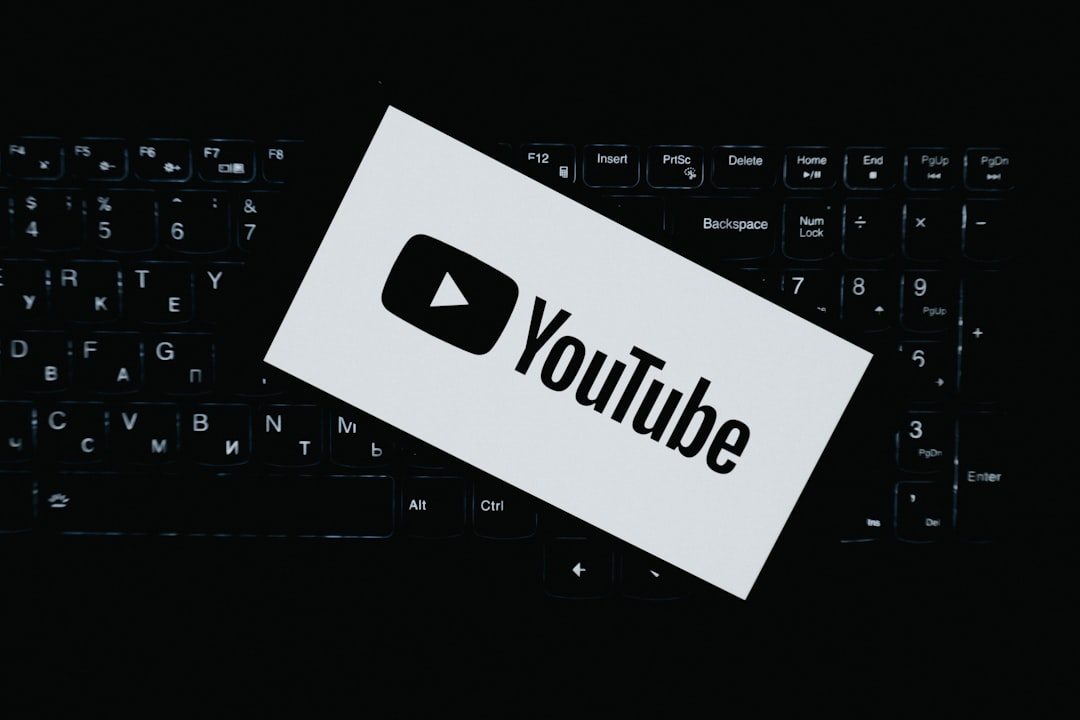 youtube logo on a dark keyboard download button saved video laptop browser