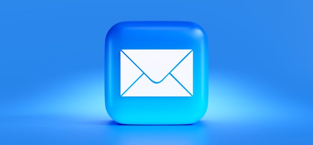 a blue button with a white envelope on it cold email inbox testing professional communication 1