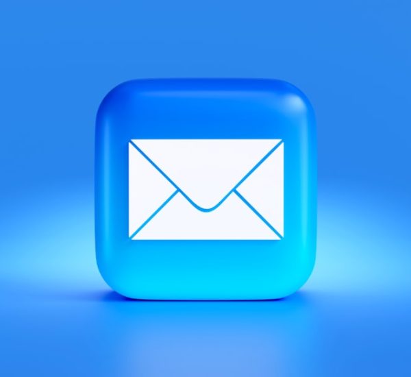 a blue button with a white envelope on it cold email inbox testing professional communication 1